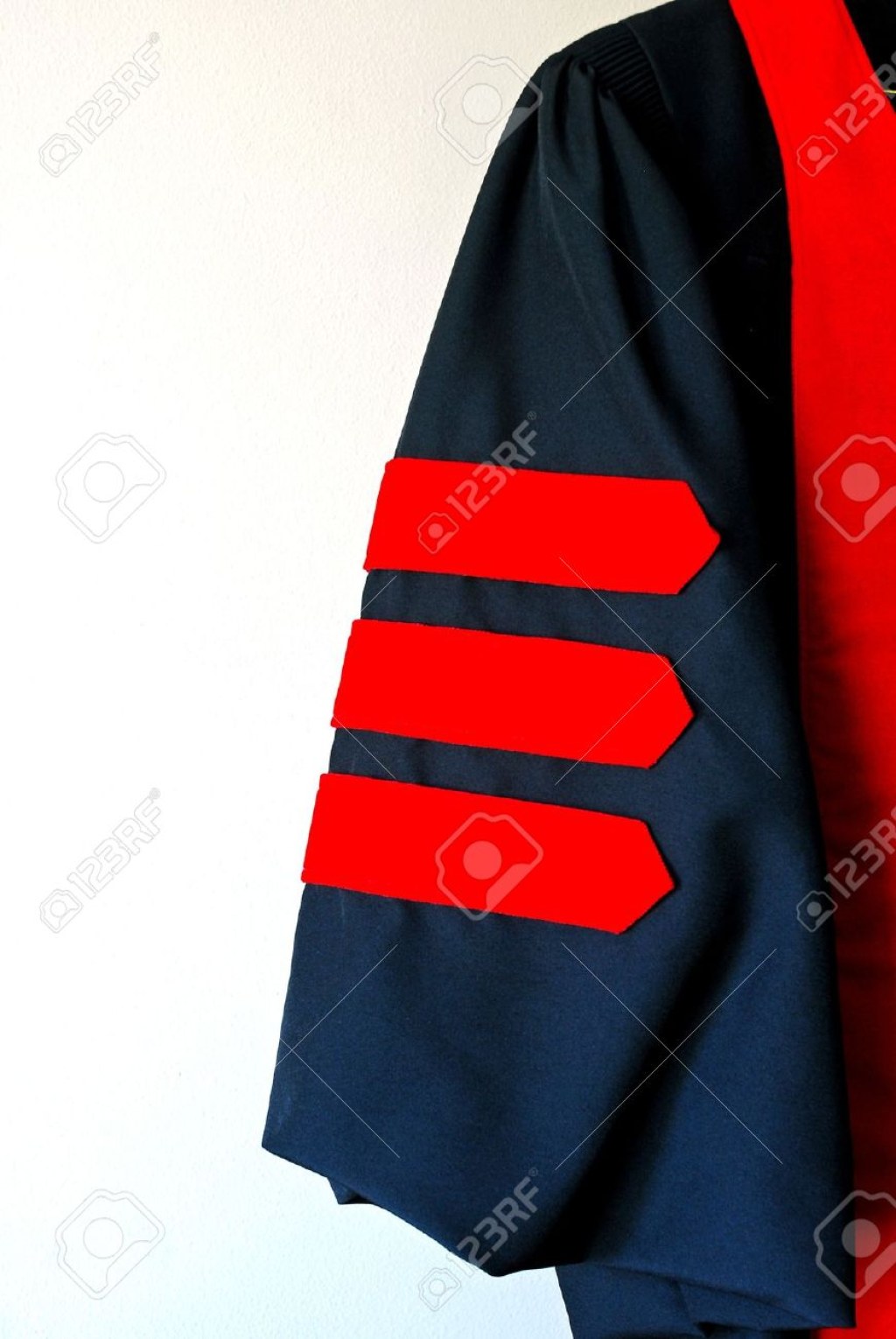 Picture of: Sleeve Of Black Graduation Robe With Three Red Doctoral Stripes